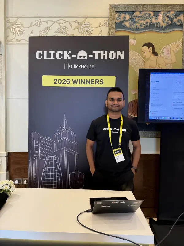 Deepak beside the Click-a-thon 2026 winners standee