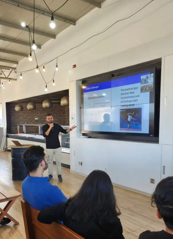 Deepak presenting a talk on scale challenges to an audience at Razorpay